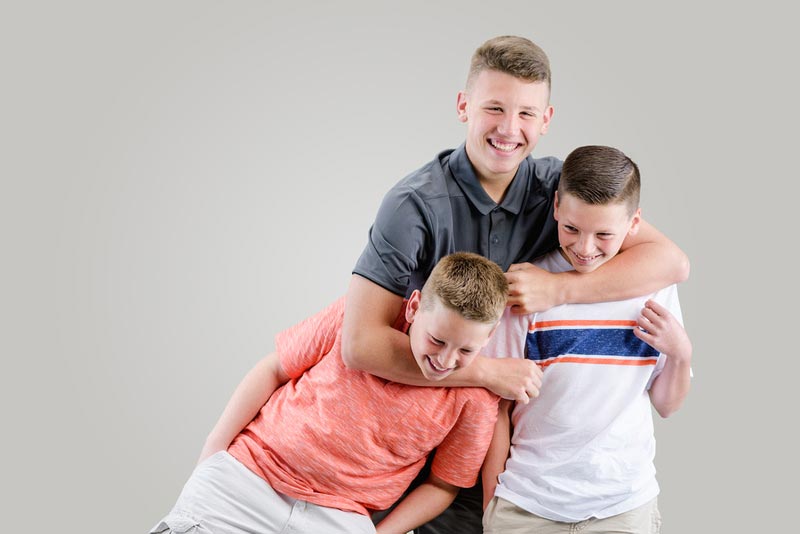 3 brothers roughhousing