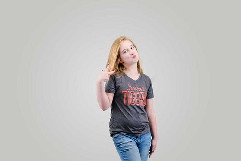 girl showing peace sign