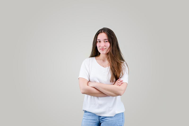 smiling girl with crossed arms