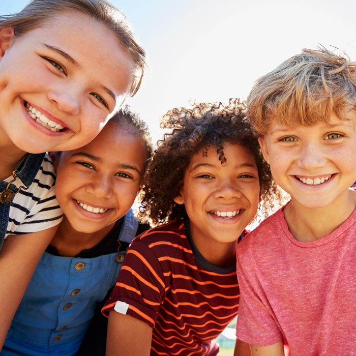 4 kids smiling